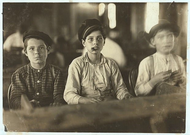Young Cigarmakers in Englahardt & Co., Tampa, Fla. There boys looked under 14. Work was slack and youngsters were not being employed much. Labor told me in busy times many small boys and girls are employed. Youngsters all smoke. Location: Tampa, Florida.