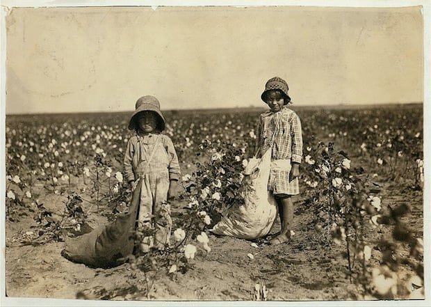 Jewel and Harold Walker, 6 and 5 years old, pick 20 to 25 pounds of cotton a day. Father said: "I promised em a little wagon if they'd pick steady, and now they have half a bagful in just a little while."  Location: Comanche County, Oklahoma