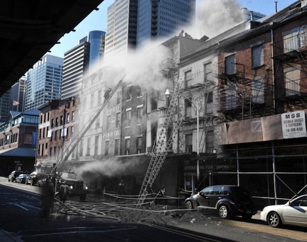 Firefighters put out a fire at the Fulton Fish Market in the South Street Seaport on February 26th, 1961. 