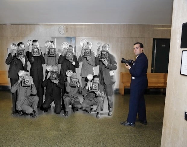 Photographer and creator of this series Marc A. Hermann standing next to the shadow of his colleagues from 70 years ago.