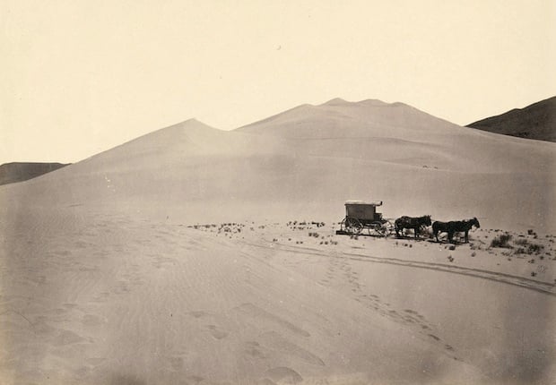 Timothy O'Sullivan's darkroom wagon, pulled by four mules. Taken in the Carson Sink part of Nevada's Carson Desert in 1867.