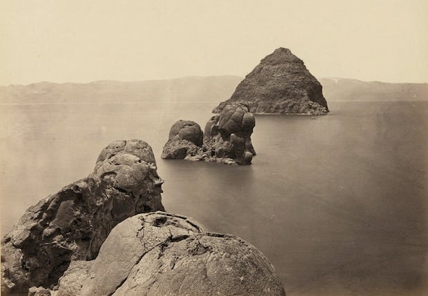 The Pyramid and Domes, a line of dome-shaped tufa rocks in Pyramid Lake, Nevada. Taken in 1867.