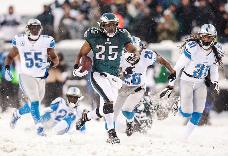 Eagles running back LeSean McCoy outruns a group of Lions defenders on his way to the end zone in the fourth quarter of the Eagles 34-20 win over the Lions in Philadelphia, Pa. on Sunday afternoon, December 8, 2013.