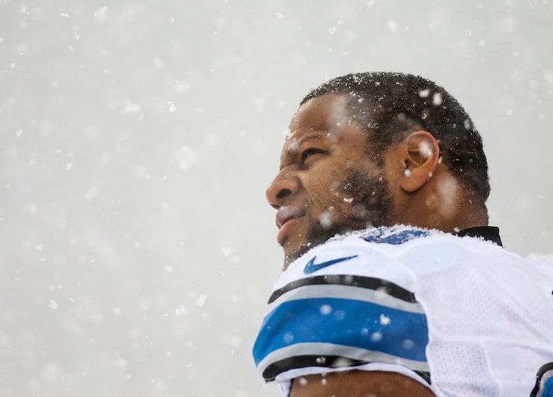 Detroit Lions defensive lineman Ndamukong Suh stands along the sideline as snow falls before the Lions take on the Eagles on Sunday afternoon, December 8, 2013.