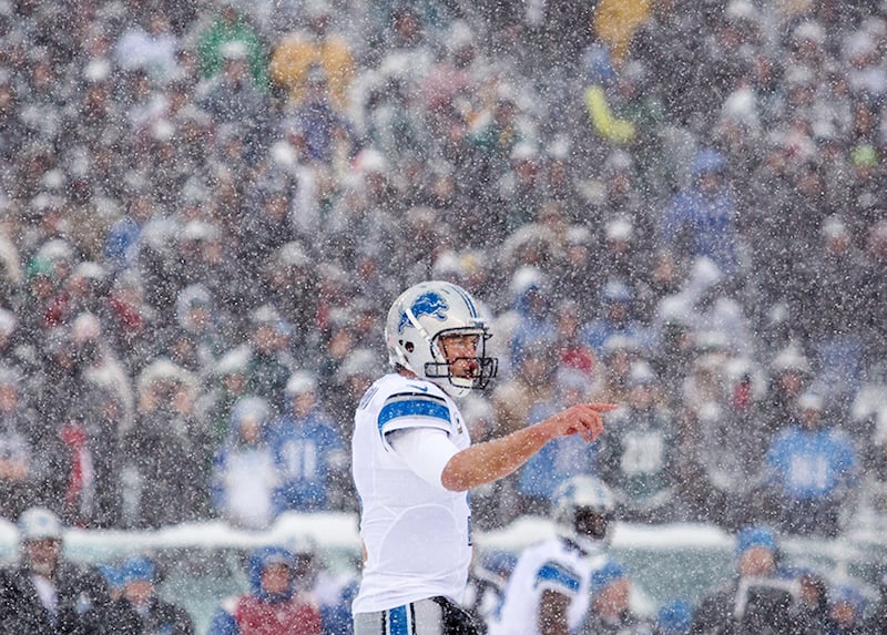 Lions quarterback Matthew Stafford gives instructions to his lineman as snow falls in the second quarter of the Eagles game against the Detroit Lions on Sunday afternoon, December 8, 2013.