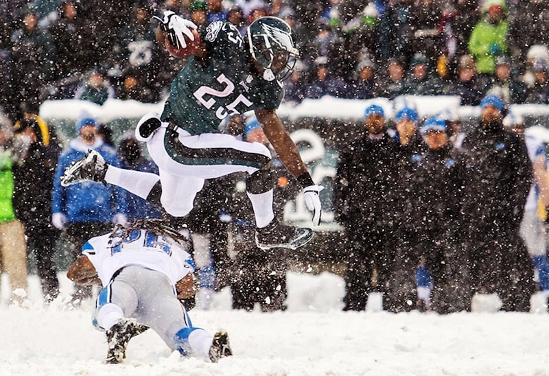 Eagles running back LeSean McCoy hurdles over Lions safety Louis Delmas in the fourth quarter of the Eagles 34-20 win over the Lions in Philadelphia, Pa. on Sunday afternoon, December 8, 2013.
