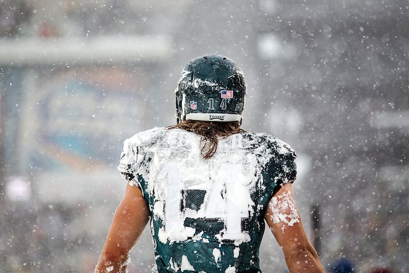 Eagles wide receiver Riley Cooper walks back to the bench covered in snow after failing to bring in a pass in the end zone on fourth down in the second quarter of the Eagles game against the Detroit Lions on Sunday afternoon, December 8, 2013.