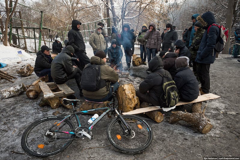 People get warm next to campfire. Is revolution possible without a bicycle? I say no!