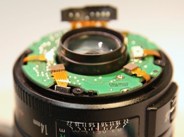Canon 14mm f/2.8 II rear barrel showing hollow screw hole in polycarbonate inner barrel where the lens mount attaches.