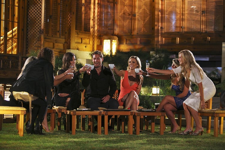 Juan Pablo and the girls doing a group toast during the after party. (Photo by ABC TV/Christopher Jue)