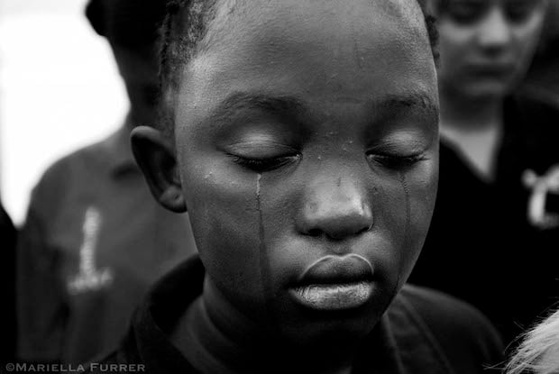 A schoolmate of Sheldean's cries during her memorial service. Pretoria, March 2007.
