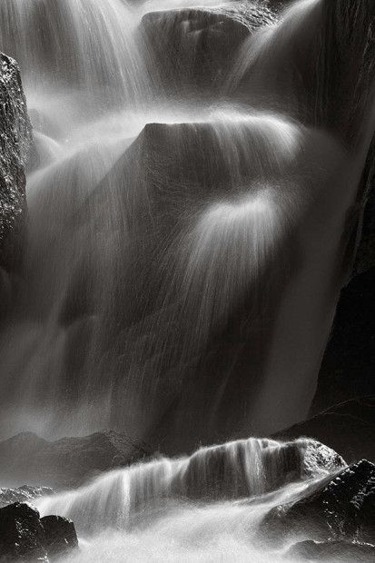 A small, unnamed waterfall flows near the Marie Lakes.