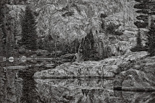 Reflections break the dawn’s stillness on a corner of Cabin Lake.