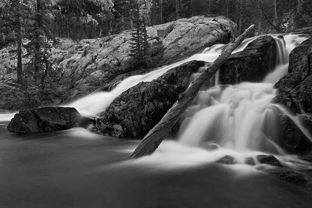 Summer runoff cascades in Shadow Creek at dusk.