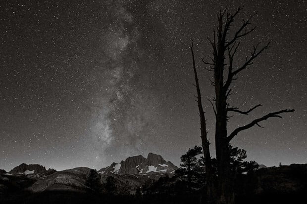 The Milky Way and Banner Peak shine in the moonlight from Summit Lake.