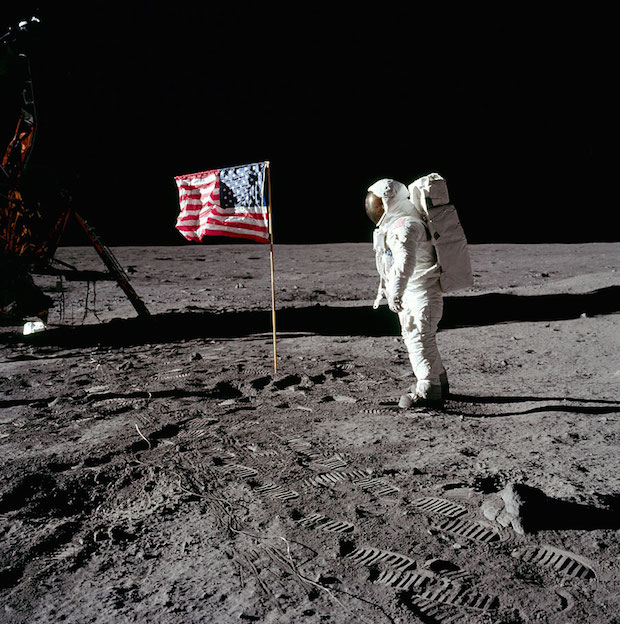 Buzz Aldrin salutes U.S. Flag.