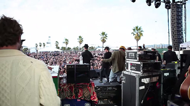 Haney filming from the stage of a show, as seen in the trailer.