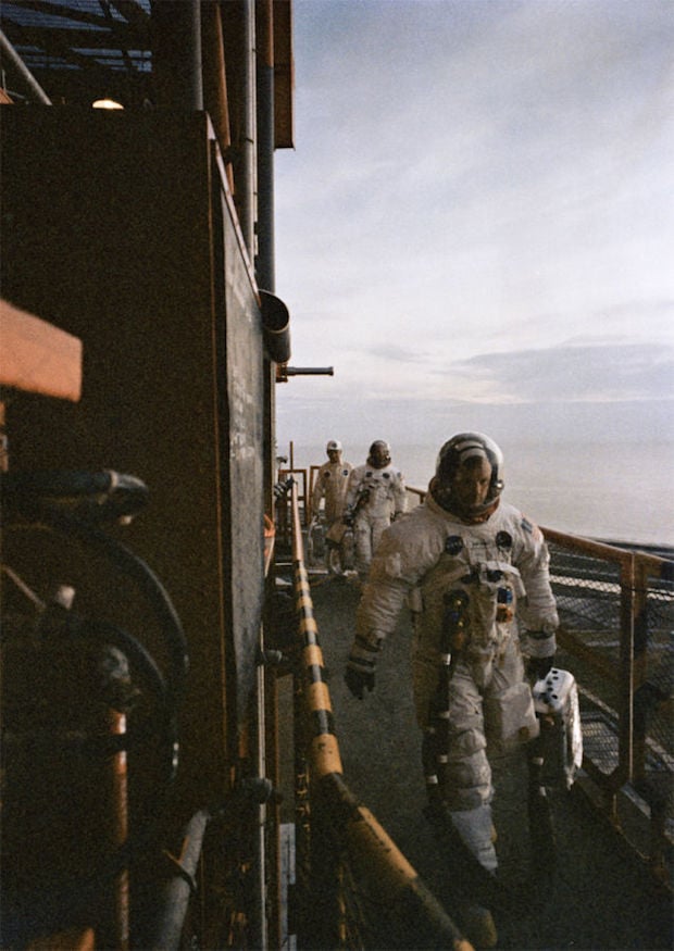 The crew of Apollo 11 take their final steps on Earth before stepping foot into the vehicle that would take them to the moon. 