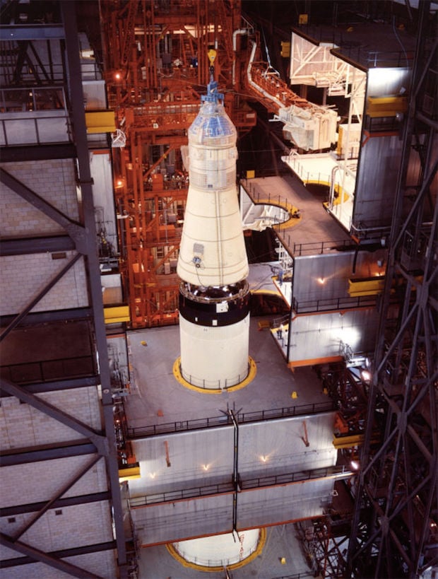 The attaching of the Apollo 11 spacecraft to the Saturn V launch vehicle.