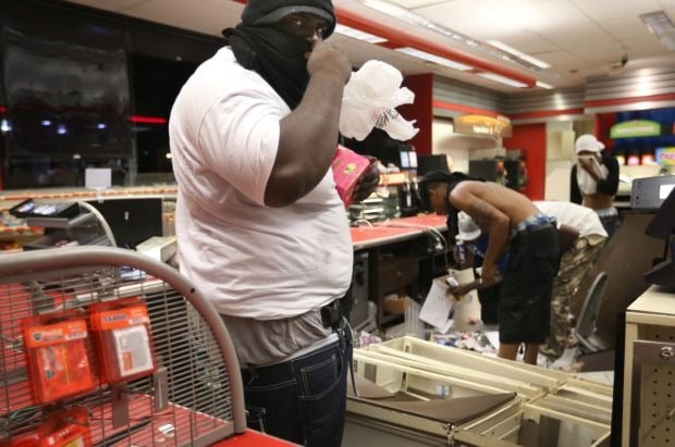 Photojournalist Attacked While Covering Riots and Looting in Missouri