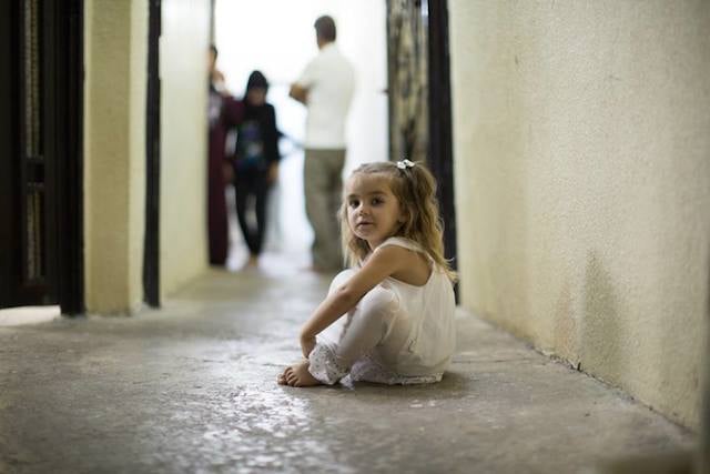 “She speaks more languages than anyone in the family. Because she plays with all the children in the street.” (Erbil, Iraq)