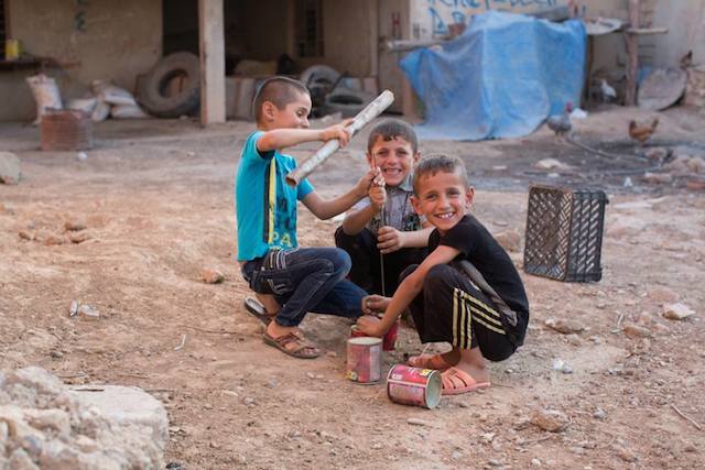 These children are members of Iraq’s Yazidi minority, who are one of many minorities deemed expendable by ISIS militants. In the last few days, ISIS has moved into their villages and taken their homes. Tens of thousands of the villagers fled into a nearby range of mountains. Realizing this, ISIS circled the mountains with guns, blocked all the roads, and waited for them to die of thirst in the 120 degree heat. These children belonged to some of the families lucky enough to escape. While their parents were panicking about their relatives trapped in the mountains, these kids found a quiet place to play. I found them banging on some cans. I asked them what they were doing. “We’re building a car,” they said. "Isn’t that cute," I thought. "They’re imagining the cans are cars."When I came back 5 minutes later, they had punctured holes in all four cans. Using two metal wires as axles, they turned the cans into wheels, and attached them to the plastic crate lying nearby. They’d built a car. (Dohuk, Iraq)