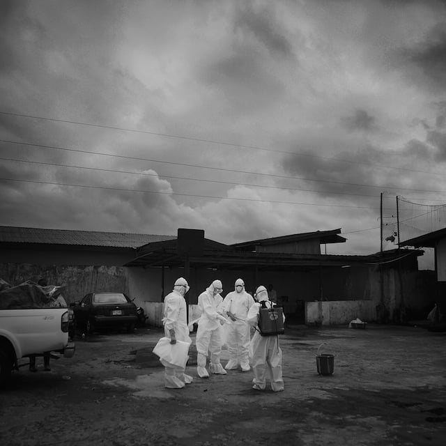 Ebola body removal team getting ready to go in an retrieve the bodies.