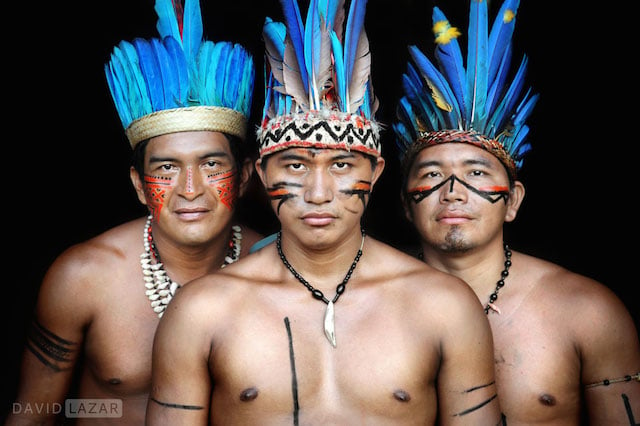 Three men looking serious but relaxed in Amazonas, Brazil
