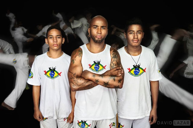 A Capoeira master and his students in Sao Paulo, Brazil, arranged in a symmetrical pattern