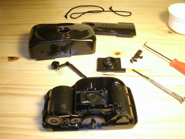 The camera disassembled to expose the internal workings.