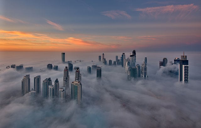 Premium AI Image  Cinematic shot of Burj Khalifa with clouds fog