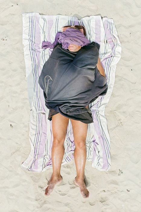 Uncomfortable Photographs Of Sunbathers Sleeping Comfortably On A Beach