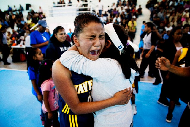Victoria Ocampo, from the village of Yavesia, weeps with joy after winning the final game in her category.