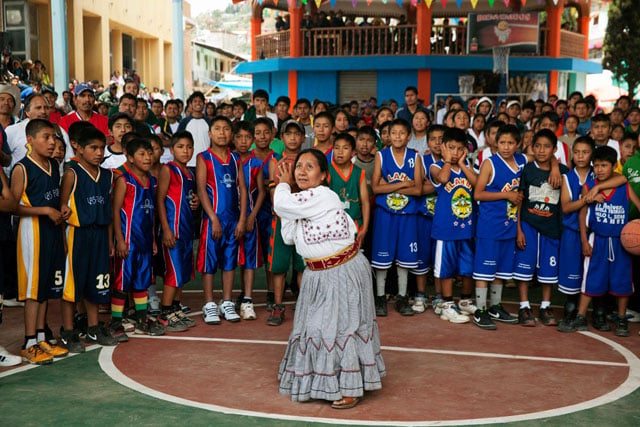 Tlahuitotepec's first female mayor Sofia Robles, takes the opening shot at the basketball tournament.