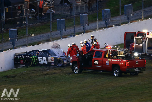NASCAR Xfinity Series driver Kyle Busch (54) is attended to by medical staff after a wreck during the Alert Florida 300 at Daytona International Speedway.