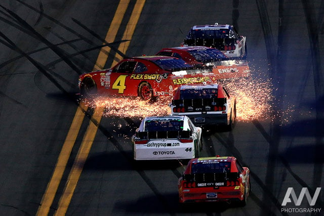 NASCAR Xfinity Series driver Ross Chastain (4) and Kyle Larson (42) crash and throw sparks during the Alert Florida 300 at Daytona International Speedway.