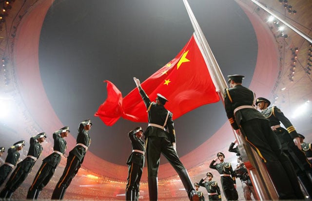 China's national flag is raised during the opening ceremony of the Beijing 2008 Olympic Games at the National Stadium, August 8, 2008. Jerry Lampen.