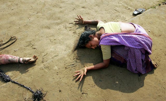 An Indian woman mourns the death of her relative who was killed in the tsunami in Cuddalore, south of the southern Indian city of Madras, December 28, 2004. Arko Datta.