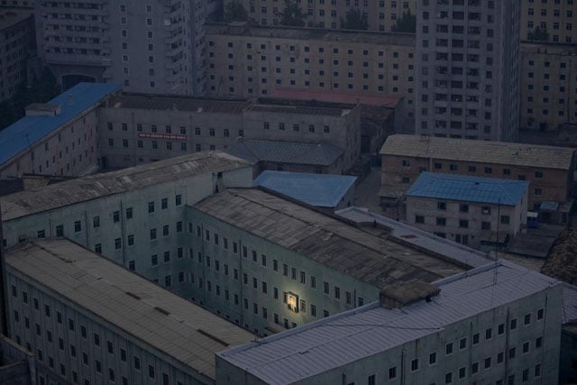 A picture of North Korea's founder Kim Il-sung decorates a building in the capital Pyongyang, early October 5, 2011. Damir Sagolj.