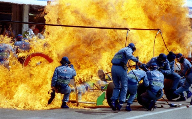 Petrol sprays on the Formula One racing car of Netherland's Jas Verstappen seconds before the car and the crew of Benetton Ford caught on fire during refueling at the German F-1 Grand Prix in Hockenheim, July 31, 1994. Joachim Herrmann.