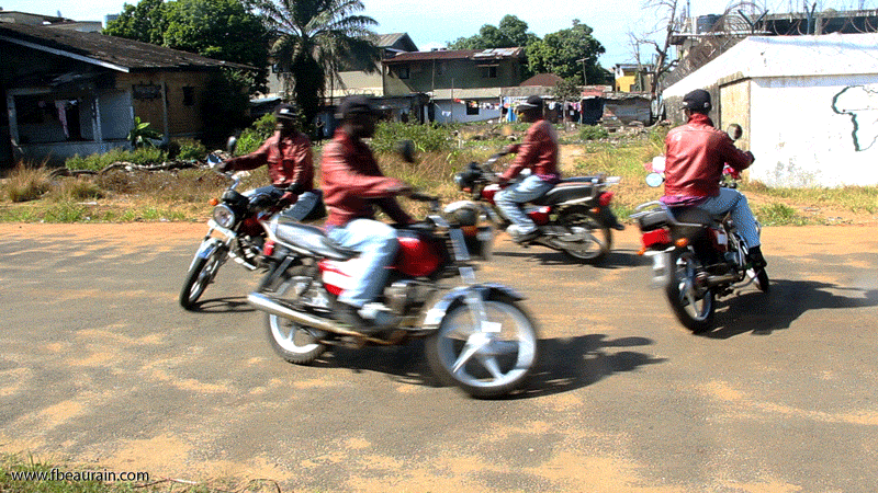 Cheap imported Chinese motorbikes are the most common transport for people and goods in Monrovia. You can easily put up to 3 or 4 people on a motorbike like this. End of 2013, a ban excluding motorbikes (so-called pen-pens) from the main axes of Monrovia has severely complicated the life of many inhabitants but at the same time also made the streets safer and quieter.