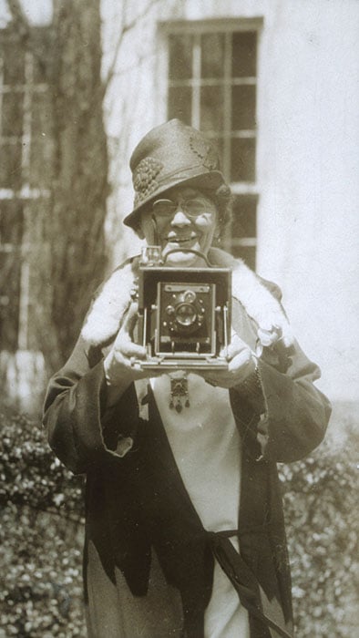 Beals posing outside the White House with her camera