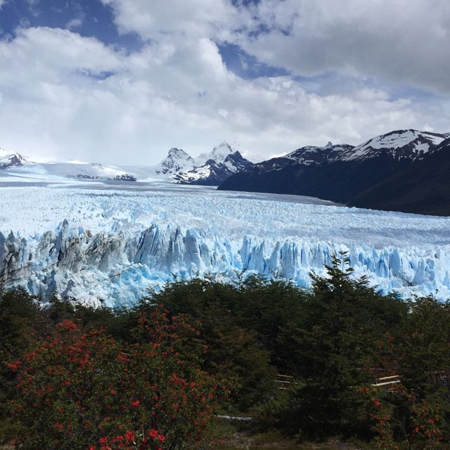 Shot by Kim G. in El Calafate, Argentina. Aligning elements along the imaginary lines dividing an image into thirds — the way the trees, glacier, and mountains are seen here — can bring balance to a composition.