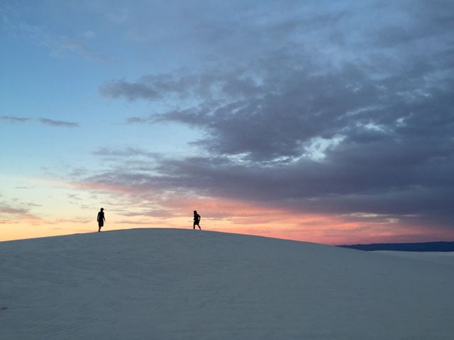 Shot by Sarah P. in White Sands, NM. Capturing people in nature shots can help define the scale of the setting and make it more compelling. The silhouettes in this photo amplify the desert’s vastness and turn an ordinary landscape into a story.