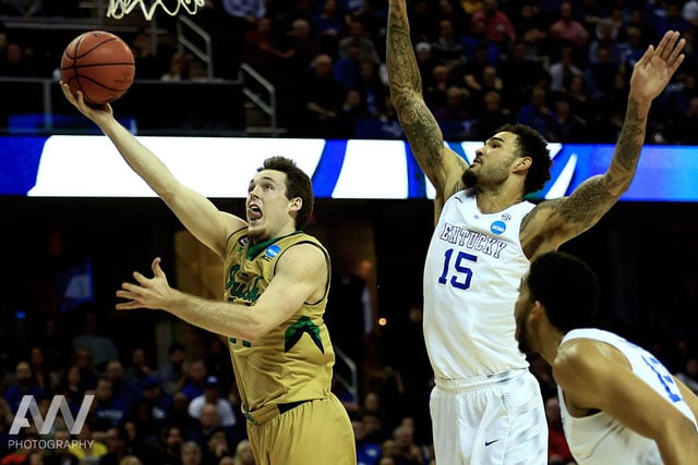 Notre Dame Fighting Irish guard/forward Pat Connaughton (24) shoots while guarded by Kentucky Wildcats forward Willie Cauley-Stein (15) during the first half in the finals of the midwest regional of the 2015 NCAA Tournament at Quicken Loans Arena.