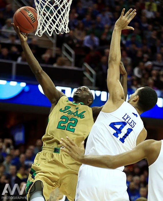 Notre Dame Fighting Irish guard Jerian Grant (22) shoots while guarded by Kentucky Wildcats forward Trey Lyles (41) during the first half in the finals of the midwest regional of the 2015 NCAA Tournament at Quicken Loans Arena.