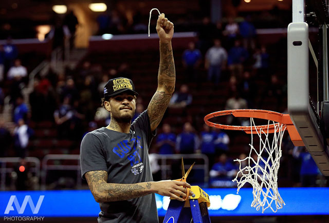 Kentucky Wildcats forward Willie Cauley-Stein (15) cuts the net after the game against the Notre Dame Fighting Irish in the finals of the midwest regional of the 2015 NCAA Tournament at Quicken Loans Arena. Kentucky won 68-66.