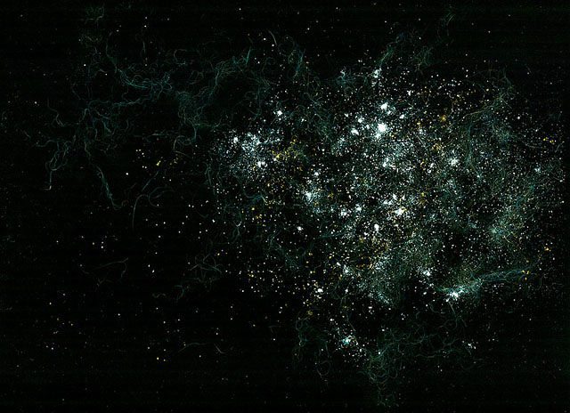 Nebula with gas streams created with cat fur, garlic powder, salt, flour, cumin, and turmeric.