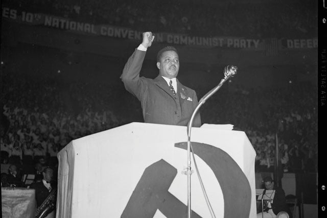 James W. Ford giving a speech in front of the Communist Party.