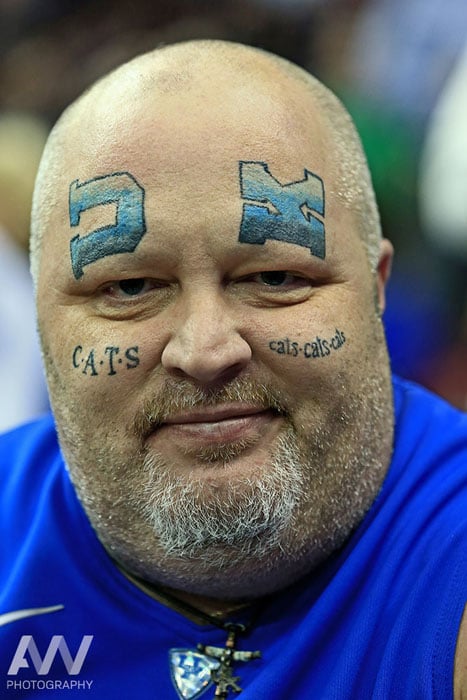 Kentucky Wildcats fan Thomas Younce shows off his tattoos prior to the game against the Notre Dame Fighting Irish in the finals of the midwest regional of the 2015 NCAA Tournament at Quicken Loans Arena.